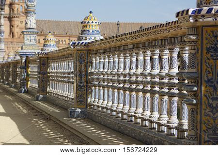 Detail of a ceramic decorated railing (handrail) in Sevilla (Seville) in Southern Spain in front of the famous Plaza de Espana
