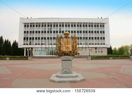 Tomsk. Russia. Coat of arms in the area. Tomsk Region Administration building