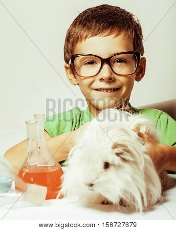 little cute boy with medicine glass isolated wearing glasses smiling close up science concept