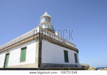Lighthouse in the coastline of Corrubedo Galicia Spain