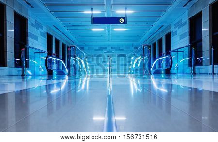 A glass staircase in a modern building. Illuminated points. Transportation concept. Modern architecture. Blue colored.
