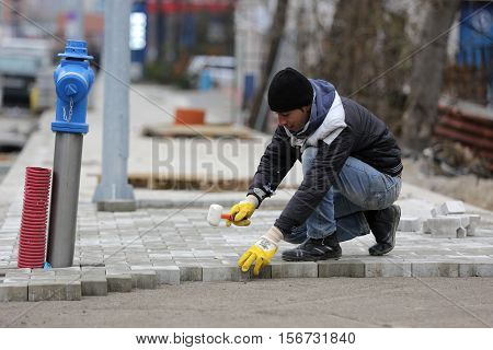 Paving Stone Worker