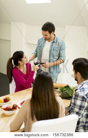 Young People Sitting By The Table