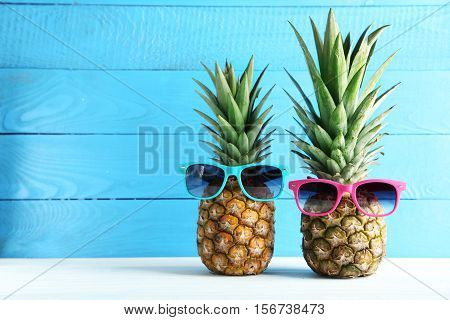 Ripe Pineapples On A White Wooden Table