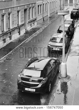 Chomutov Ustecky kraj Czech republic - November 02 2016: Lidicka street with parked cars glistening after autumnal rain