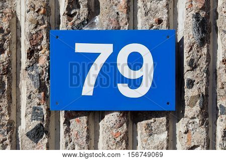 Blue plate with number 79 in white.