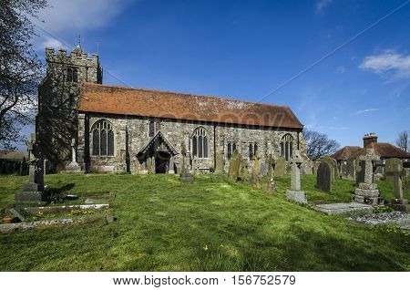 Church of St George and graveyard Brede Kent UK