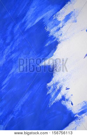 brushstrokes of blue paint made by a finger