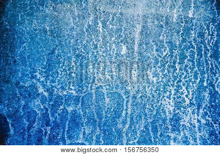 blue corrosion on metal metal with abstract pattern.