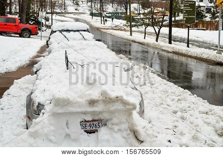Charlottesville, USA - March 6, 2013: JPA street with a lot of snow piled on cars after winter storm