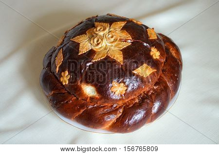 Traditional Ukrainian wedding bread called korovai or karavai with decorations