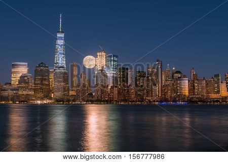Perigee full moon over the skyscrapers of lower Manhattan-New York