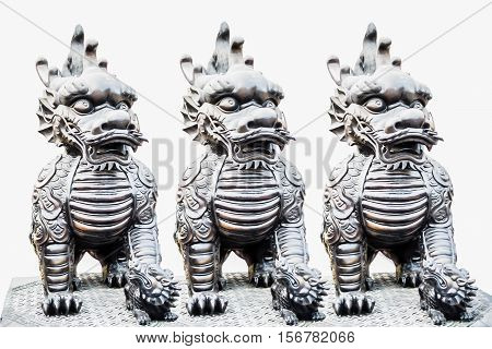 Three sculpture of Dragon-headed unicorn in Thailand.
