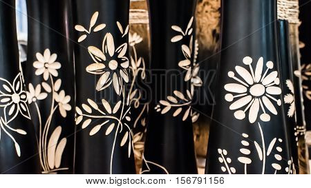 Many engraving flowers on the black wood.