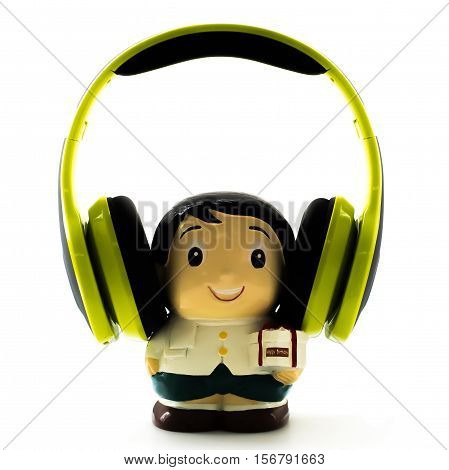 A boy doll is listening to music happy birthday.