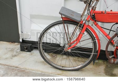 bicycle red vintage near of wall white background