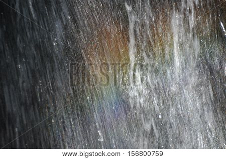 Rainbow at the waterfall Millomeris in the mountains in Cyprus