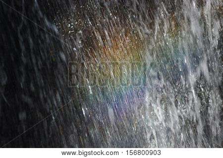 Rainbow at the waterfall Millomeris in the mountains in Cyprus