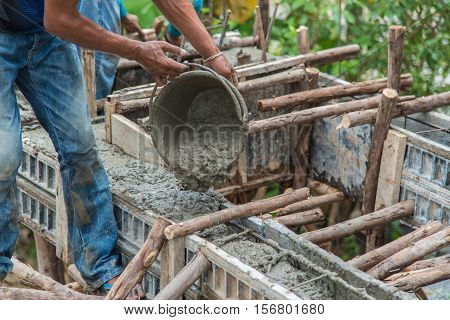 Concrete pouring during commercial concreting floors of buildings in construction(Commercial Building)