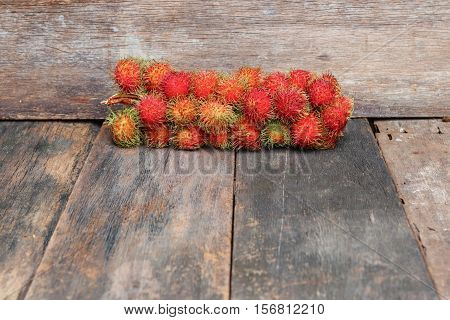 rambutan sweet fruit fresh on wood background