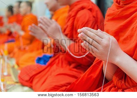 Buddhist Monks Chanting Or Praying In Temple Thailand