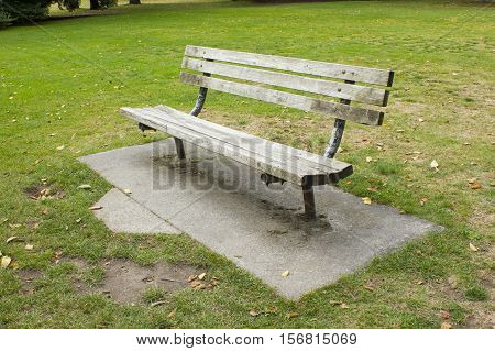 Empty benches on the lawn in the park. Open air