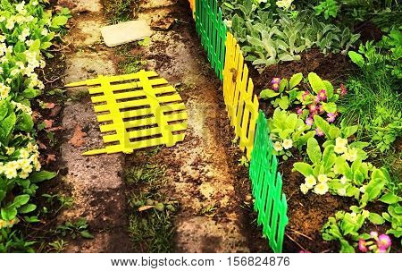 beautiful part of the floral garden with decorative fence