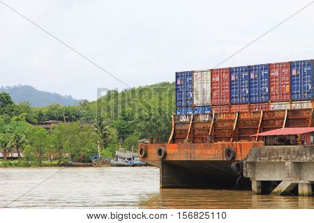 Trang Thailand - November 17  2016: Containers at sea port of Kantang River. marketplace for people to send goods around the world.