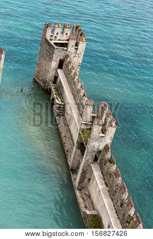 Backwater inside the Scaliger Castle - medieval port fortress Sirmione Italy
