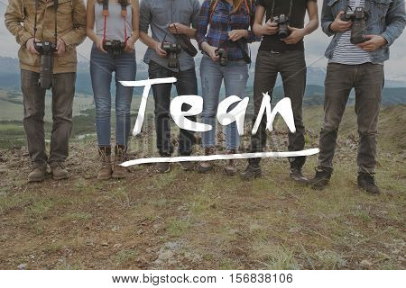 Team group of friends photographers on mountainds backdrop. Teamwork photography concept