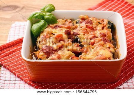 Casserole with roasted eggplants stuffed with minced meat.
