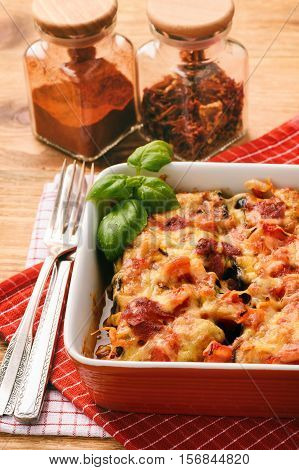 Casserole with roasted eggplants stuffed with minced meat.