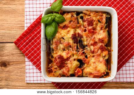 Casserole with roasted eggplants stuffed with minced meat.