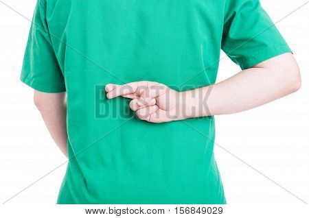 Back View Of Male Doctor Holding Fingers Crossed