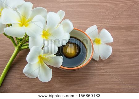 Raw Egg in soy sauce and Plumeria flower,Tamago kake gohan