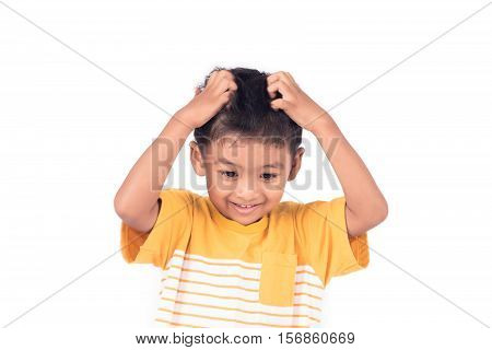 Cute childe asian little boy scratching head