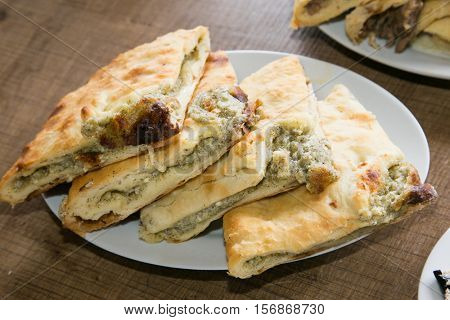 Traditional Georgian cheese and millet pie - khachapuri. The national cuisine of Georgia. Europe.