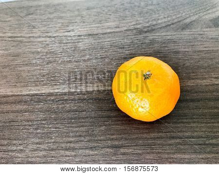 bright shades of orange on a wooden table.