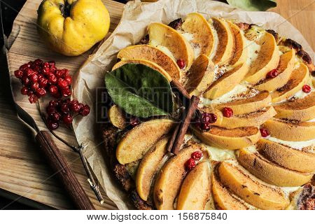 quince tart with custard open and shortcrust pastry. viburnum and cinnamon.