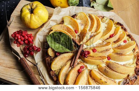quince tart with custard open and shortcrust pastry. viburnum and cinnamon.