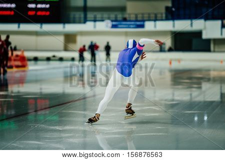 explosive start athlete speed skater to sprint on ice rink. competitions in speed skating