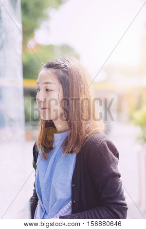 Young Hipster Woman, Chinese Women In Thiking Someting At The Prak With Fresh Air.