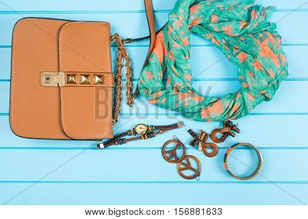 Set of the fashionable women's acsessories. Blue wooden background.