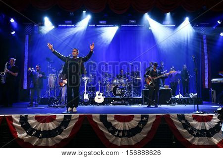 NEW YORK - MAY 21: Actors J.W. Cortes (L) and Gary Sinise perform onstage with the Lt. Dan Band at a benefit concert at the Hard Rock Cafe on May 21, 2015 in New York City.
