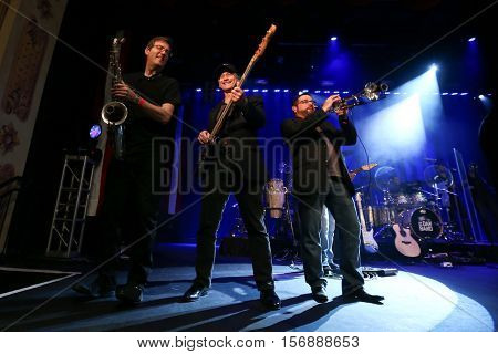 NEW YORK - MAY 21: Actor Gary Sinise (C) performs onstage with the Lt. Dan Band at a benefit concert at the Hard Rock Cafe on May 21, 2015 in New York City.
