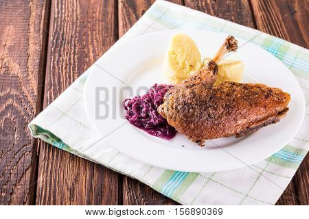 Duck Breast With Cabbage And Crispy Skin On White Plate