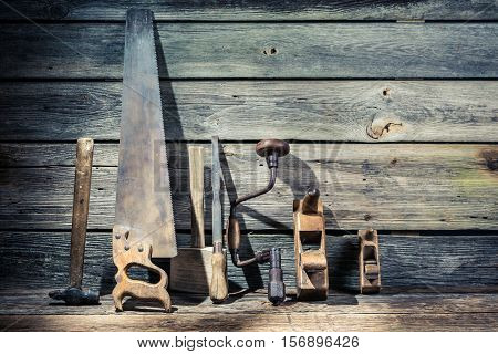 Hammer, Saw And Chisel In Vintage Workbench