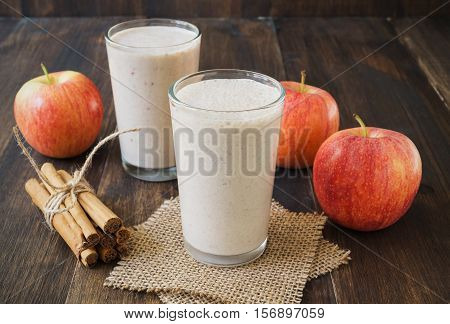 Apple cinnamon smoothie on wooden rustic table. Fall inspired breakfast. Apple pie smoothie. Healthy lifestyle concept selective focus horizontal