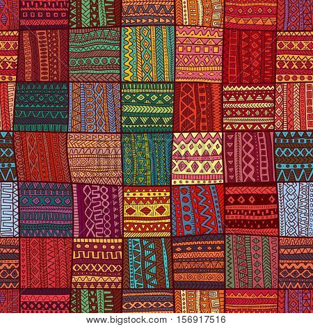 Geometric pattern in patchwork style. Seamless ornament. Ethnic and tribal motifs. Square multicolored patches. Print drawn by hand. Vector illustration.