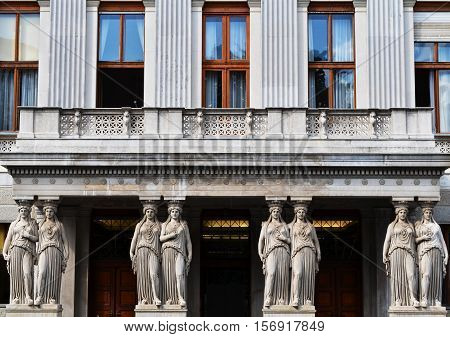 Balcony with caryatids in the Austrian Parliament Building view from Rathausplatz in Vienna